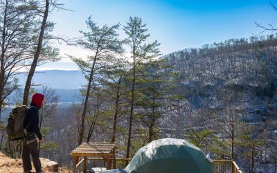 Dome 6 with a rock climber on the cliffs at The Canyon at Pond Creek in Tennessee