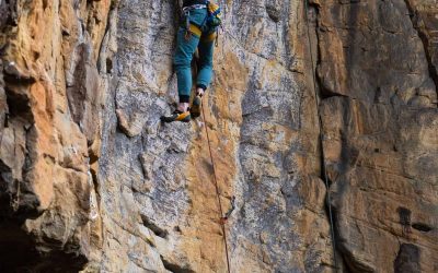 Rock climbing at the cliffs of The Canyon at Pond Creek glamping resort in Tennessee
