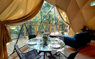 Kitchen and dining area inside Capricorn dome (Dome #6) at Falling Stars glamping on Bull Shoals Lake, Arkansas